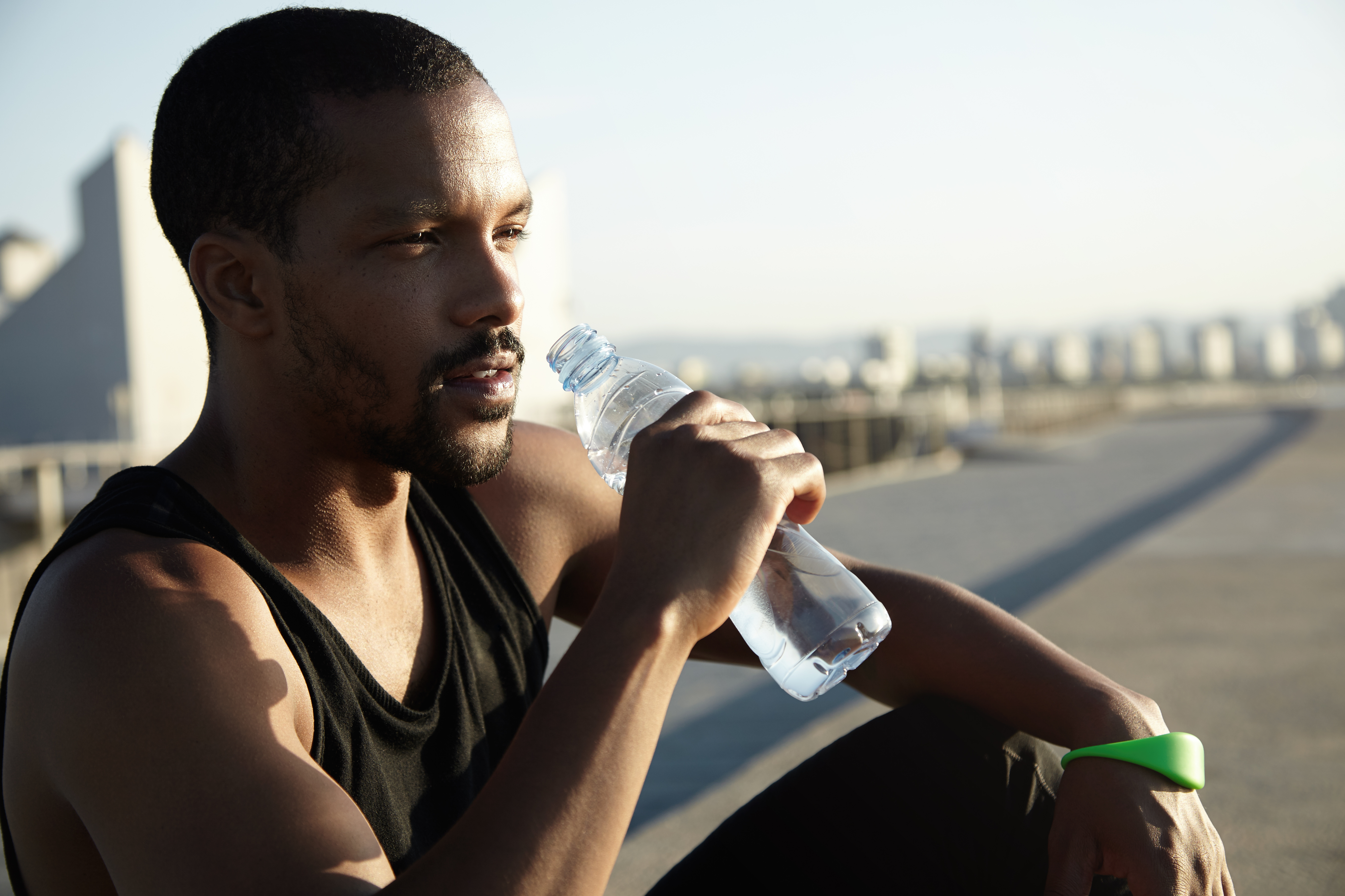 closeup-portrait-young-bearded-man-drinking-water